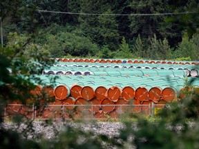 Pieces of the Trans Mountain Pipeline project sit in a storage lot outside of Hope, British Columbia.