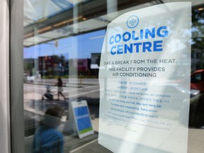 A welcoming sign is seen on the door of the Hillcrest Community Centre where they can cool off during the extreme hot weather in Vancouver, British Columbia.