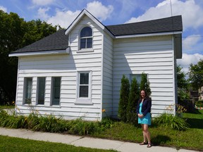 Rebecca Alexander in front of her new home in Collingwood that she was able to purchase with assistance from a $20,000 downpayment benefit offered by her employer, C.F. Crozier & Associates Ltd.