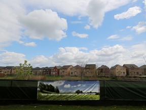 Newly built houses are seen at a subdivision near the town of Kleinburg, Ont. Many smaller municipalities have faced big cost challenges as people have fled large cities in search of more space and affordable housing.