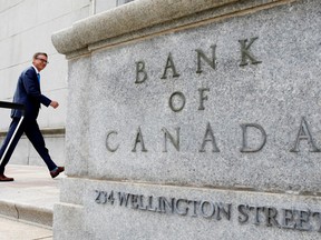 Governor of the Bank of Canada Tiff Macklem walks outside the Bank of Canada building in Ottawa.