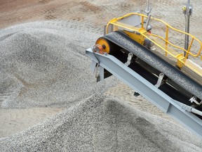 Ore falls from a conveyor onto a stockpile at a lithium mine in Australia.