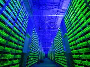 Illuminated bitcoin mining rigs in Russia. Bitcoin mining requires an enormous amount of energy.