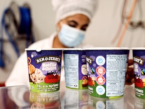 Tubs of ice-cream are seen as a labourer works at Ben & Jerry's factory in Be'er Tuvia, Israel, July 20, 2021.