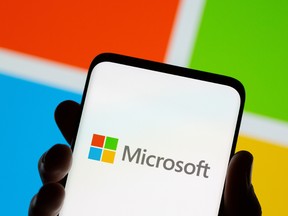 The Microsoft logo is seen on a smartphone.