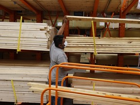 A customer buys lumber at a Home Depot in Florida.