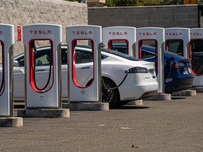 Tesla vehicles at charging stations outside a store in Rocklin, California.