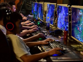 People play online games at an internet cafe in Fuyang, Anhui province, China.