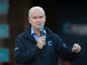 Conservative Party leader Erin O'Toole speaks to a crowd of supporters at Prarieland Park in Saskatoon, Saskatchewan, Aug. 20, 2021.