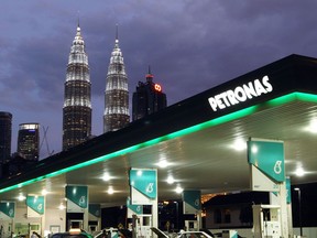 Petronas signboard is lighted at night in Kuala Lumpur,Malaysia.