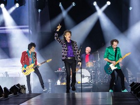 The Rolling Stones band members, left to right, Ronnie Wood, Mick Jagger, Charlie Watts and Keith Richards perform on stage during their "No Filter" tour at NRG Stadium in Houston, Texas in July, 2019. Watts, drummer with legendary British rock'n'roll band, died on Aug. 24, 2021, aged 80.