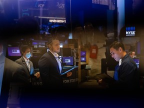 Traders work on the floor of the New York Stock Exchange in New York.