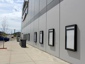 Empty movie poster frames on display outside the Landmark Cinemas theatre in Fort McMurray on Friday, June 14, 2020.