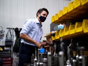 Prime Minister Justin Trudeau visits ETI Converting Equipment during his election campaign tour in Longueuil, Quebec.