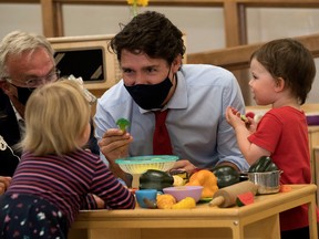 Prime Minister Justin Trudeau plays with children at the daycare in Carrefour de l'Isle-Saint-Jean school in Charlottetown, Prince Edward Island, in July.