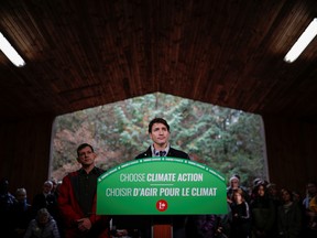 Prime Minister Justin Trudeau attends a press conference after a tree planting during an election campaign visit to Plainfield, Ont., Oct. 6, 2019.