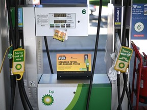 Out of use signs are attached to pumps at a BP petrol station in west London on September 24, 2021.