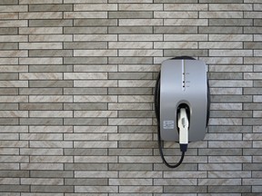 A charging plug for electric vehicles and plug-in hybrid vehicles outside a model smart home in Toyota Motor Corp.'s Ecoful Town in Toyota City, Aichi Prefecture, Japan, on Oct. 17, 2014.