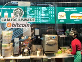 A sign reads: "Exclusive Bitcoin register" in a Starbucks store where the cryptocurrency is accepted as a payment method, in San Salvador, El Salvador. On Tuesday, the small central American nation became the first in the world to make bitcoin legal tender, meaning merchants from car dealers to coffee shops will be obliged to accept it as payment.