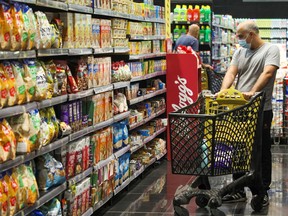 A man shops inside a supermarket in Beirut, Lebanon. The OECD says near-term inflation risks are on the upside.