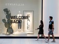 People walk at the Eaton Centre in Toronto on June 24, 2020.