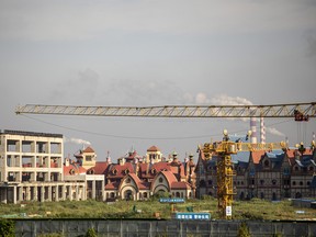 A crane at China Evergrande Group's under-construction Cultural Tourism City residential and tourism development in Taicang, Jiangsu province, China, on Sept. 24, 2021.