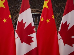 Canadian and Chinese flags at the Diaoyutai State Guesthouse in Beijing.