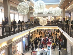 People shop at Fairview Mall in Toronto on Nov. 22, 2020.