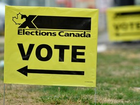 Signs outside of an advance polling station in Burnaby British Columbia. Polls show the Liberals virtually tied with the opposition Conservatives ahead of the Sept. 20 vote, raising the prospect that no party will be able to form even a stable minority government.