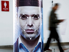A poster simulating facial recognition software in Beijing, China.