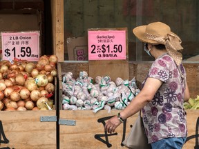 A woman shopping for food in Toronto. Canadians are reporting waning optimism over the strength of the economy.