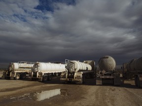Oil tanker trucks waiting to be filled in Texas. A world racing towards decarbonization due to well-intentioned but not fully informed government policy is propelling us towards an energy crisis.