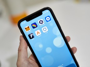 Cryptocurrency wallet apps displayed on a smartphone.