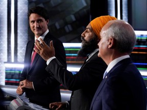 Liberal leader Justin Trudeau, left to right, NDP leader Jagmeet Singh, and Conservative leader Erin O'Toole take part in the federal election English-language leaders debate in Gatineau.