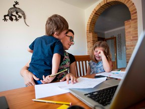 A mother tries to work from home during a pandemic lockdown.