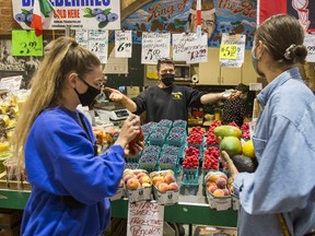 Customers shop at St. Lawrence Market in Toronto on Sept. 15, 2021.
