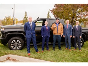 Cintas Group Vice President Erik Kielley, Cintas Omaha General Manager Chase Spencer, Cintas Senior Vice President - Norther Territory Darrell Boff and Cintas Vice President of Value Improvement Initiatives Casey Stoops presented Cintas Service Sales Representative Eric Sandmann (center) with a 2021 Silverardo Carhartt Edition truck in Omaha on Tuesday morning.