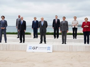 Leaders of the G7 pose for a group photo on overlooking the beach in Cornwall in June. 
Using the COVID-19 pandemic and climate change as a motivational backdrop, the G7 are out to replace the fundamentals of the market model with a new paradigm, writes Terence Corcoran.