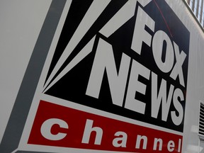 A Fox News channel sign is seen on a television vehicle outside the News Corporation building in New York City, in New York, U.S.