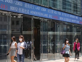 An electronic ticker displays stock figures at the Exchange Square Complex, which houses the Hong Kong Stock Exchange, in the Central district of Hong Kong, China, Sept. 20, 2021.