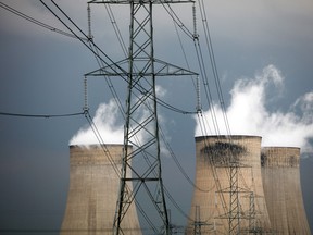 Electricity pylons stand alongside cooling towers at Uniper SE's coal-fired power station in Ratcliffe-on-Soar, U.K., on Sept. 13, 2016.