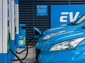 Motorists charge their electric vehicles at a Motor Fuel Group charging station on an Esso forecourt in London, U.K., on Oct. 1, 2021.