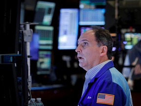 A trader works on the floor of the New York Stock Exchange in New York City, U.S., Oct. 13, 2021.