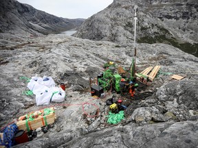 Workers of the company Greenland Anorthosite Mining drill at an exploration site of an anorthosite deposit close to the Qeqertarsuatsiaat fjord, Greenland, Sept. 11, 2021.