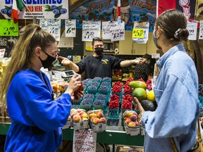 People shop at St. Lawrence Market in Toronto on Sept. 15, 2021.