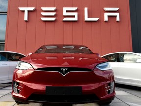 Shares of Tesla were down less than one per cent in extended market trading.