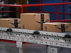 Packed and labeled boxes ready for delivery move along a conveyor belt at the Amazon fulfillment center in Baltimore, Maryland, U.S., April 30, 2019.