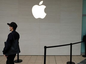 Members of the public outside an Apple Inc. store in Kawasaki, Japan, on Oct. 16, 2021.