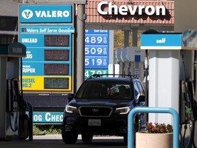 Gas prices nearing US$5.00 per gallon at Valero and Chevron stations on Oct. 12, 2021 in Mill Valley, California.