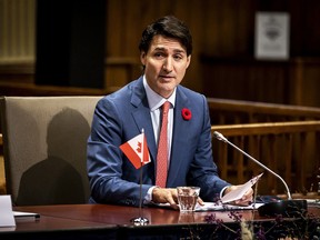 Canadian Prime Minister Justin Trudeau looks on in the Ridderzaal on the Binnenhof, in the Hague, on October 29, 2021. - Trudeau visited various locations in the Netherlands, which had to do with the climate and the Second World War, among other things.